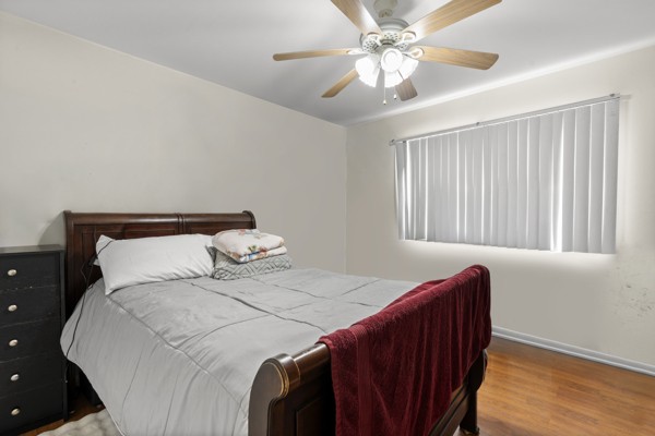 613 Hillsboro Road, Unit B17 Franklin, TN 37064 - Photo 20 of 27 a bedroom with a bed and a chandelier