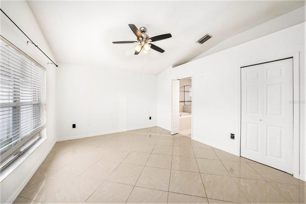 5644 Grindstone Loop Wesley Chapel, FL 33544 - Photo 15 of 29 a view of an empty room with a window