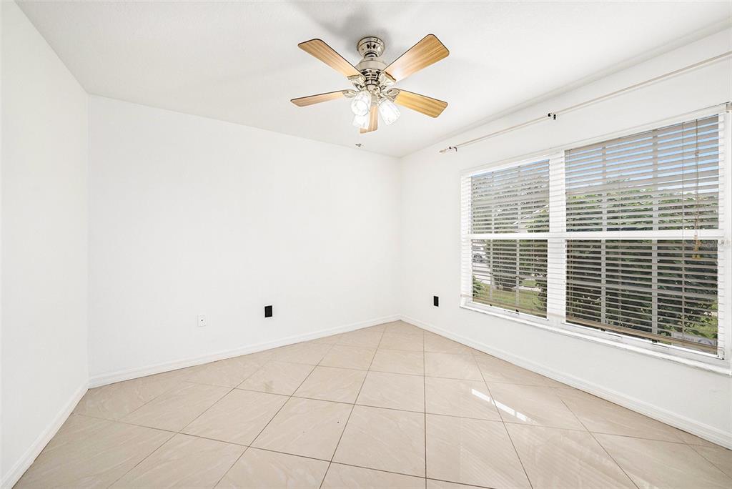 5644 Grindstone Loop Wesley Chapel, FL 33544 - Photo 19 of 29 a view of an empty room with a window