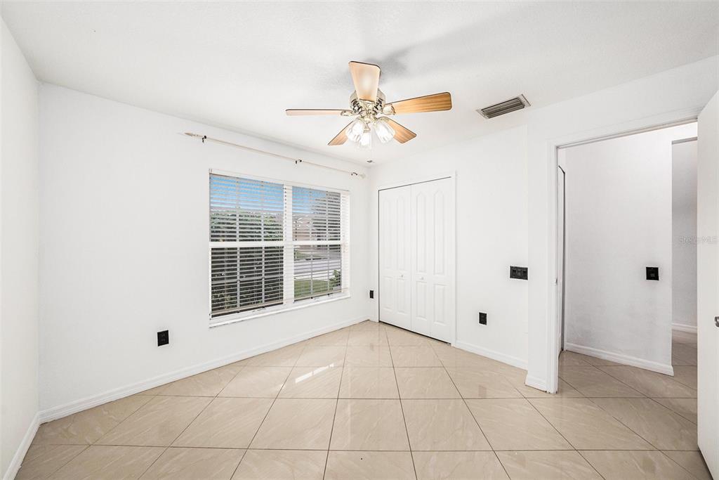 5644 Grindstone Loop Wesley Chapel, FL 33544 - Photo 20 of 29 a view of an empty room with a window