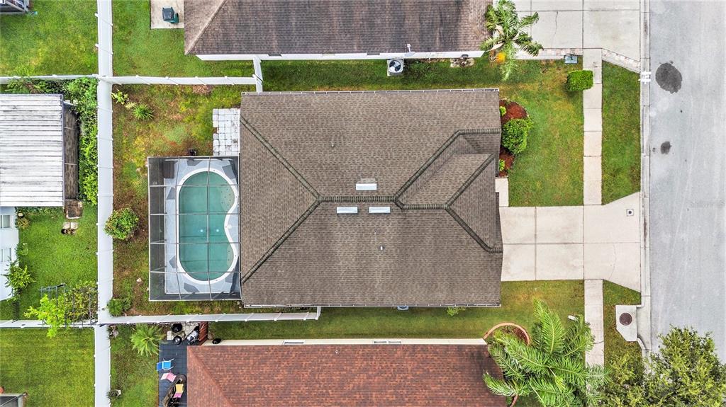 5644 Grindstone Loop Wesley Chapel, FL 33544 - Photo 27 of 29 a aerial view of a house with garden space and a bench
