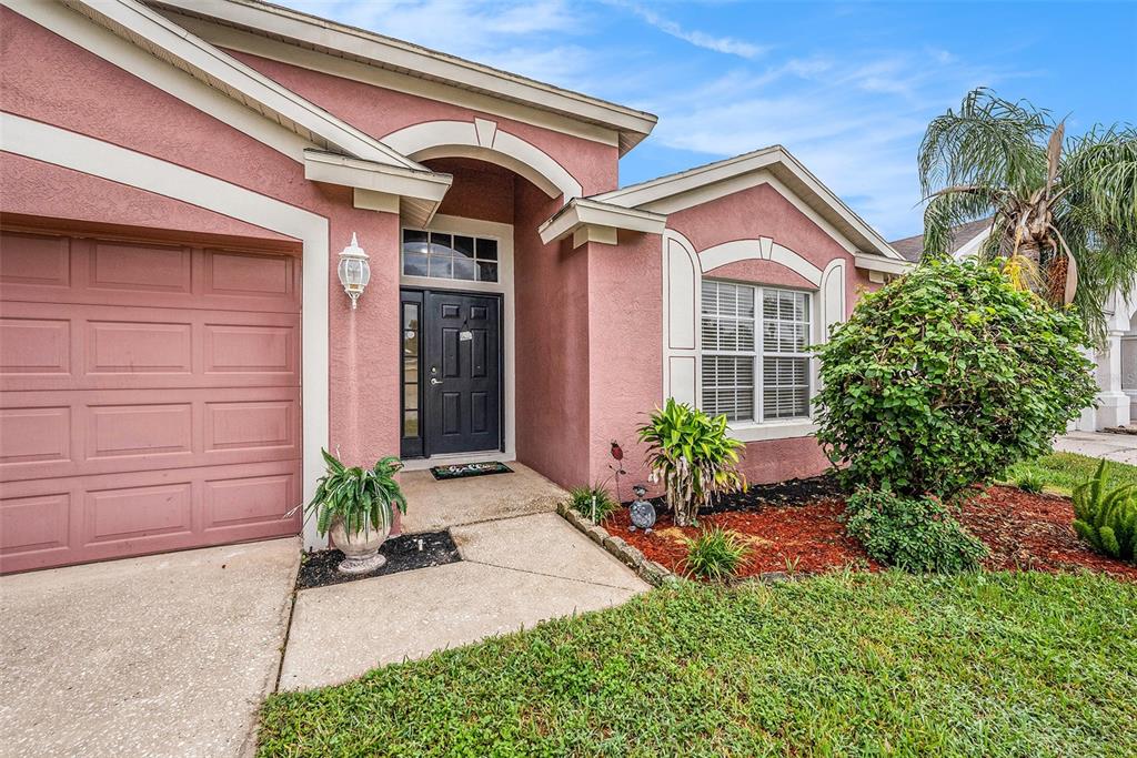 5644 Grindstone Loop Wesley Chapel, FL 33544 - Photo 4 of 29 a front view of a house