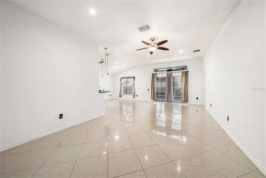 5644 Grindstone Loop Wesley Chapel, FL 33544 - Photo 6 of 29 a view of an empty room with a window