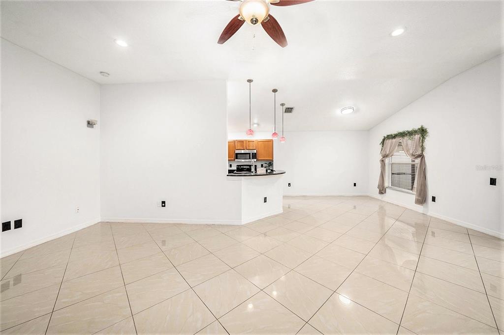 5644 Grindstone Loop Wesley Chapel, FL 33544 - Photo 9 of 29 a view of a room with cabinet and window