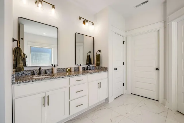 a bathroom with a tub and a shower