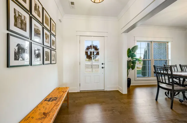a view of a dining room with furniture window and wooden floor