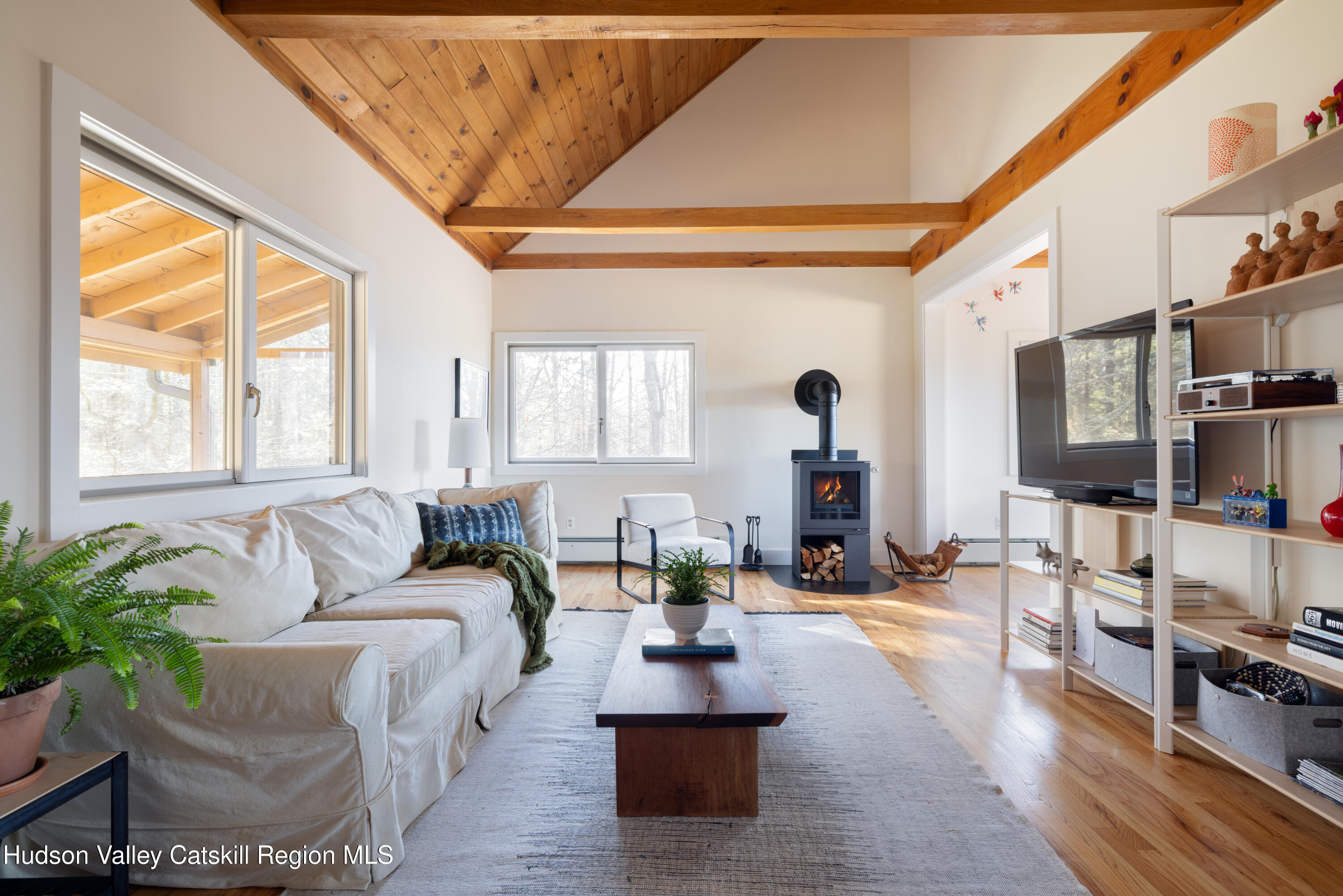 827 Ashokan Road Kingston, NY 12401 - Photo 12 of 36 a living room with furniture large window and wooden floor