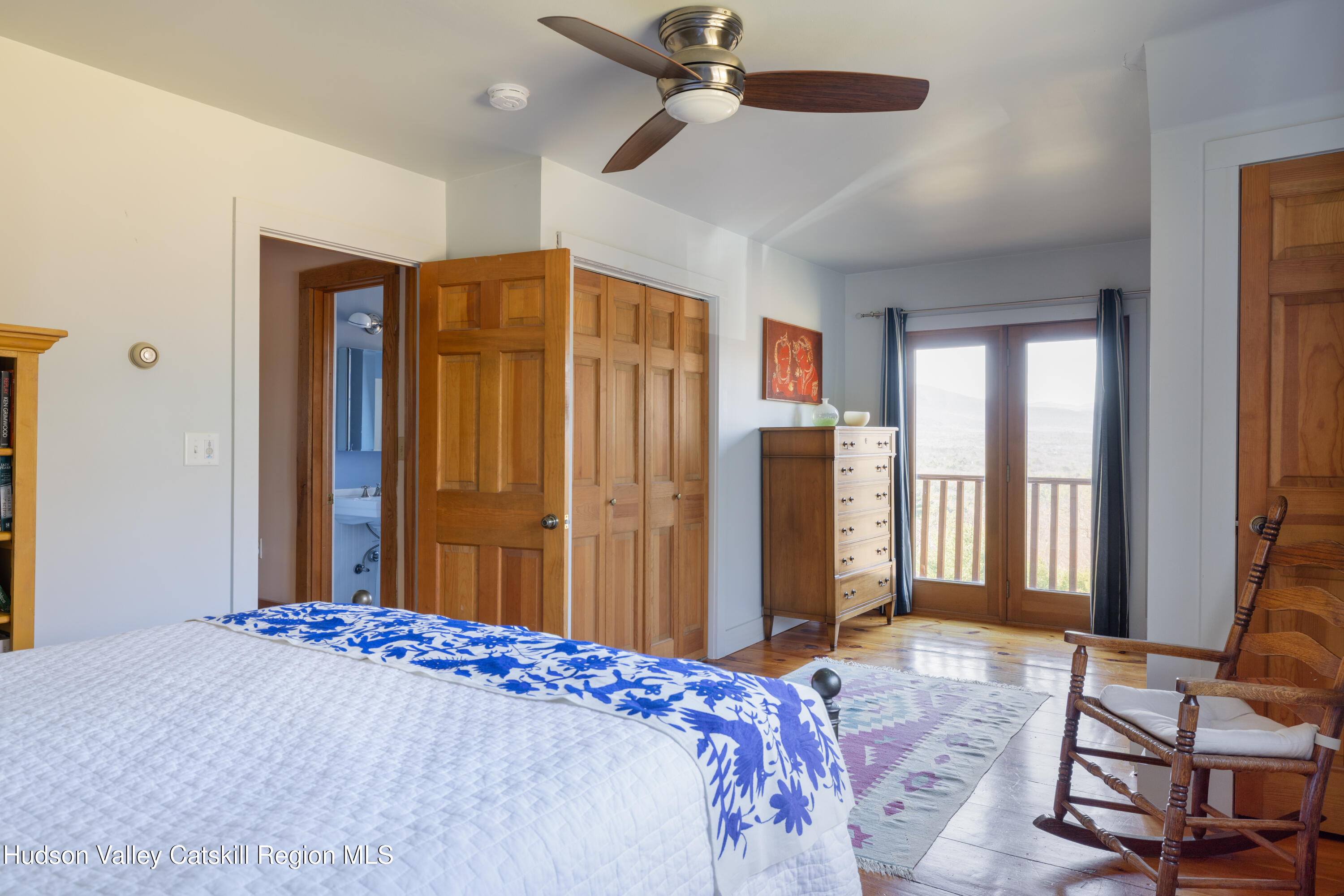 827 Ashokan Road Kingston, NY 12401 - Photo 19 of 36 a bedroom with a bed and wooden floor