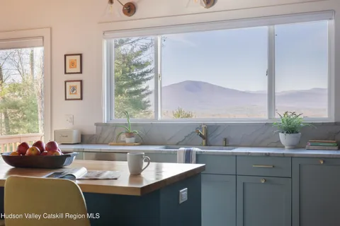 a kitchen with a sink and a window