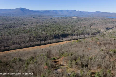 a view of a mountain range with trees