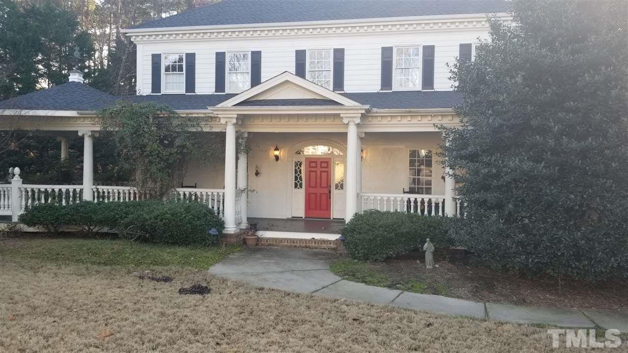105 Chalon Drive Cary, NC 27511 - Photo 2 of 9 a front view of a house with garden