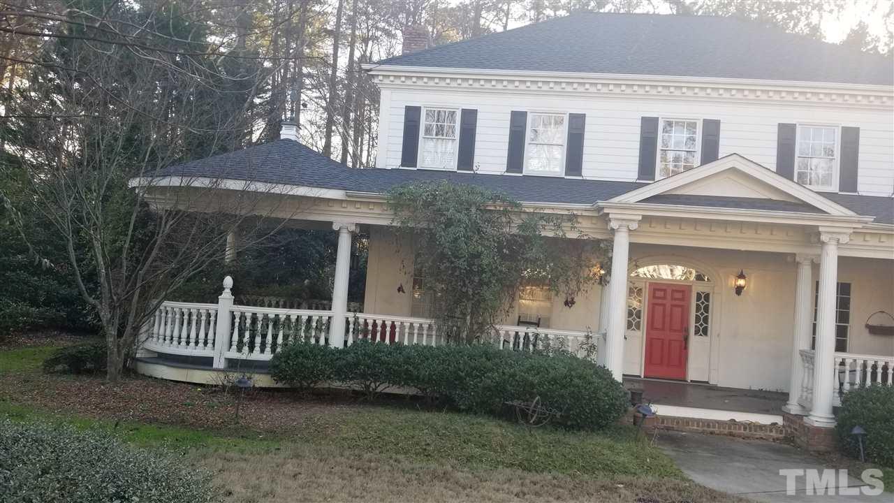 105 Chalon Drive Cary, NC 27511 - Photo 3 of 9 a front view of a house with a garden