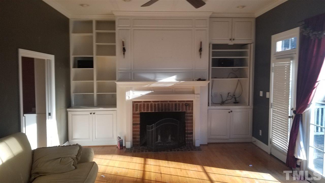 105 Chalon Drive Cary, NC 27511 - Photo 5 of 9 a living room with furniture and a fireplace