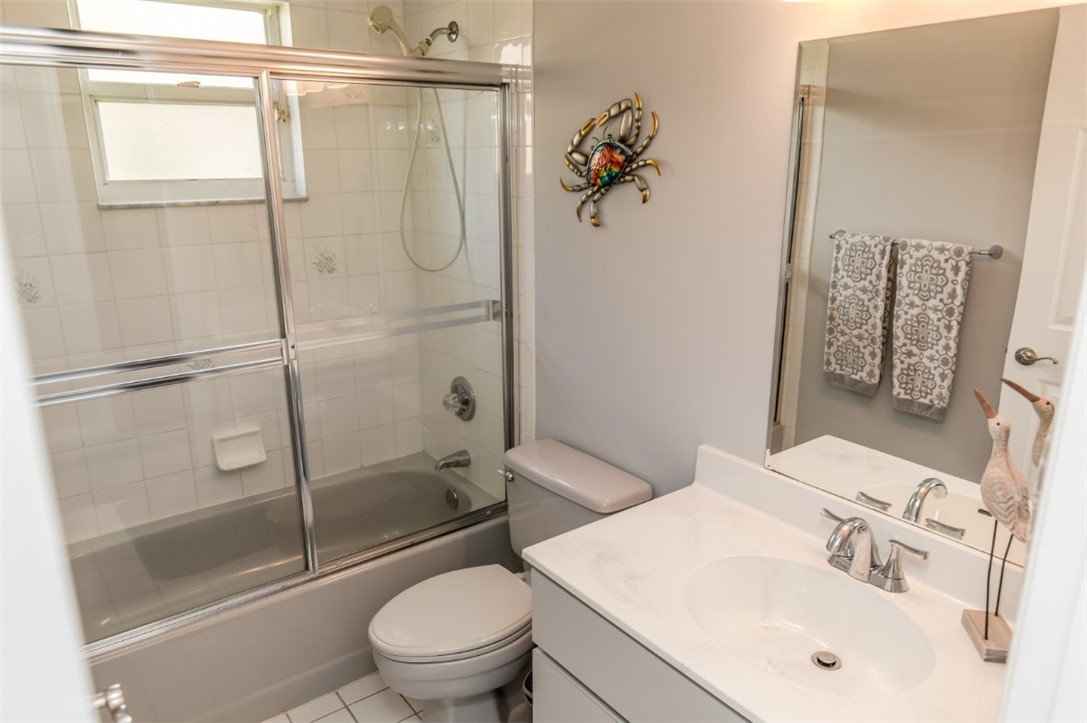 168 Midvale Terrace Sebastian, FL 32958 - Photo 18 of 25 a bathroom with a sink toilet and shower