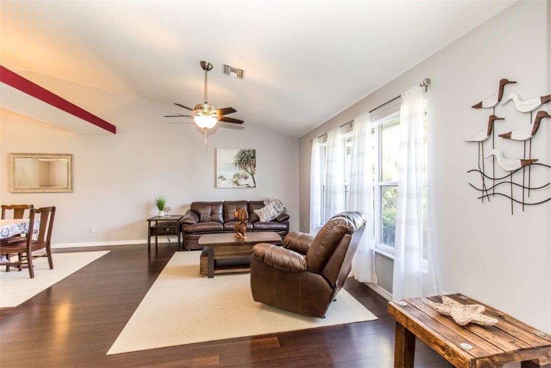 168 Midvale Terrace Sebastian, FL 32958 - Photo 2 of 25 a living room with furniture and a chandelier