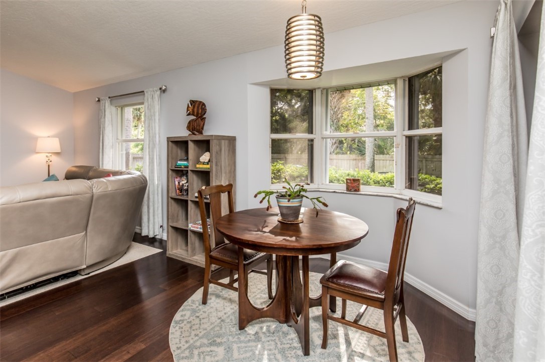 168 Midvale Terrace Sebastian, FL 32958 - Photo 21 of 25 a view of a dining room with furniture window and wooden floor