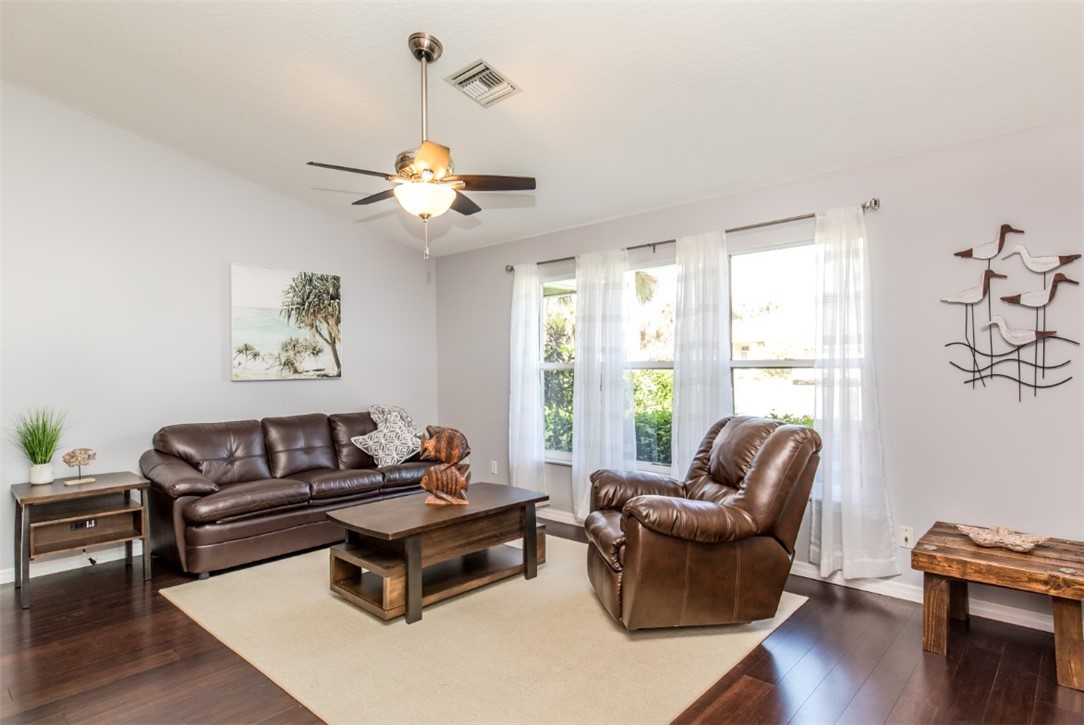 168 Midvale Terrace Sebastian, FL 32958 - Photo 4 of 25 a living room with furniture and a large window