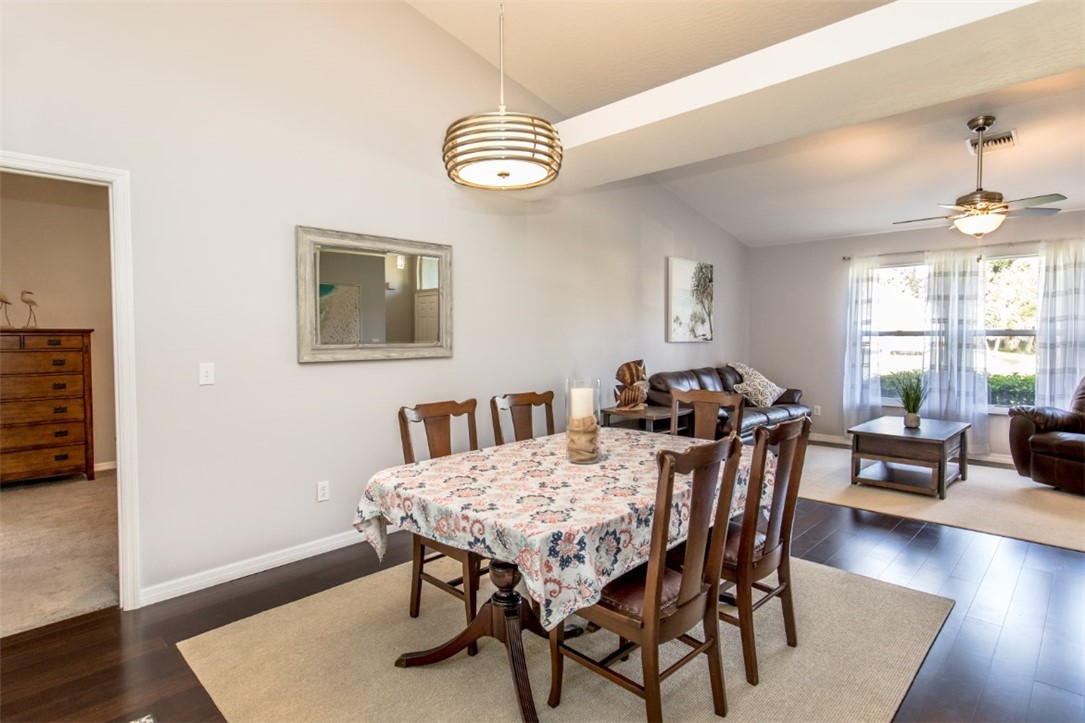 168 Midvale Terrace Sebastian, FL 32958 - Photo 5 of 25 a view of a dining room with furniture and wooden floor