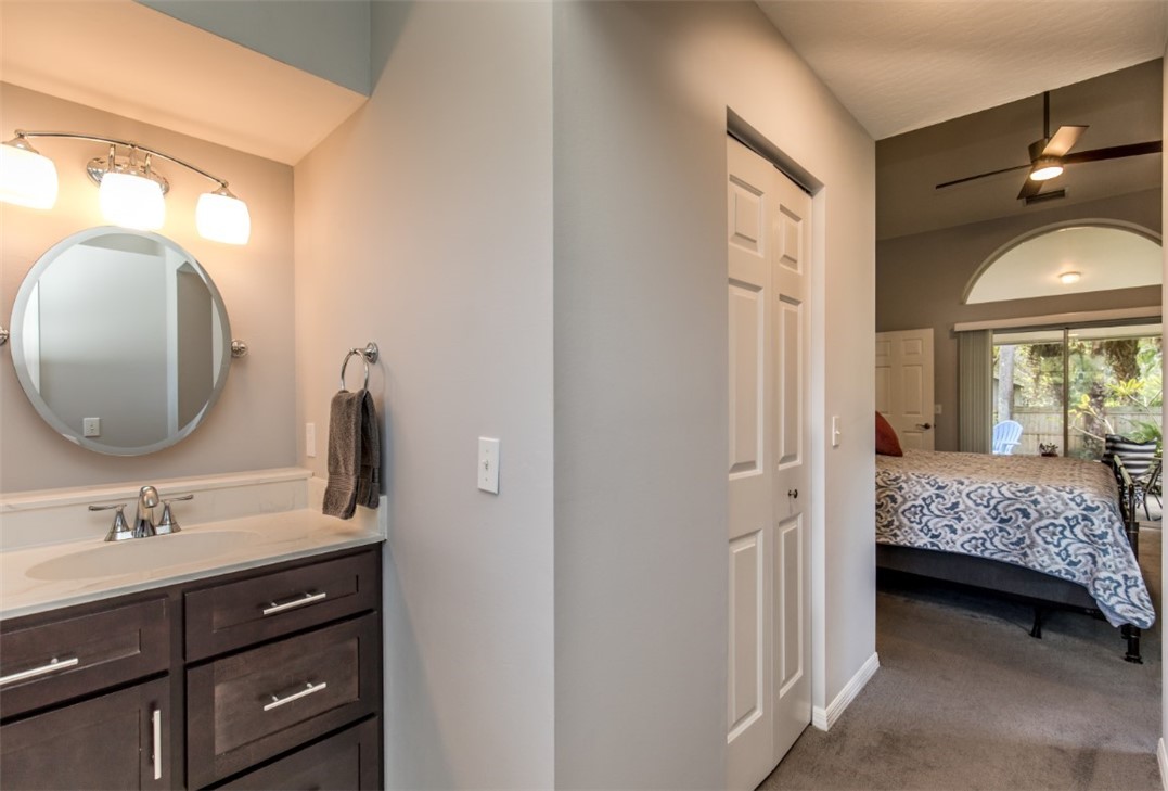 168 Midvale Terrace Sebastian, FL 32958 - Photo 7 of 25 a en suite bathroom with a double vanity sink and a mirror