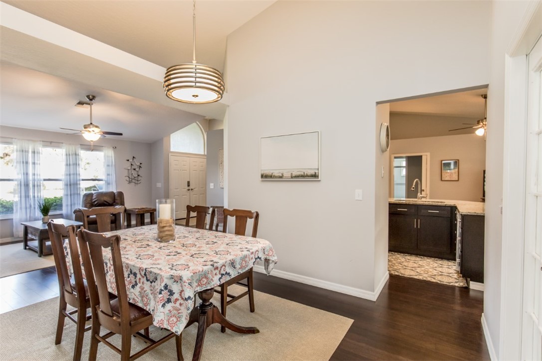 168 Midvale Terrace Sebastian, FL 32958 - Photo 10 of 25 a view of a dining room with furniture and wooden floor