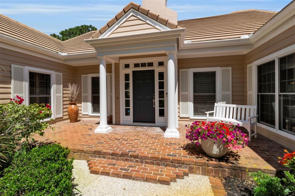 156 Bishopscourt Road Osprey, FL 34229 - Photo 15 of 84 a view of a entryway door front of house