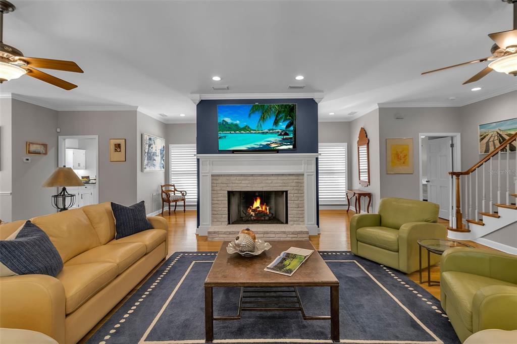 156 Bishopscourt Road Osprey, FL 34229 - Photo 24 of 84 a living room with furniture and a fireplace