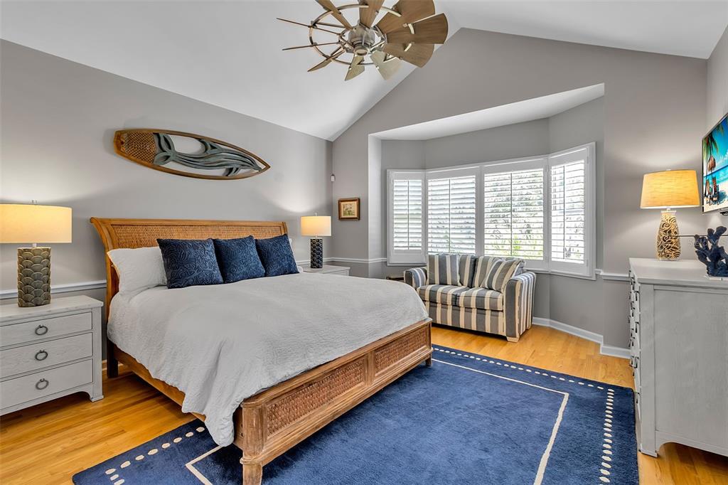 156 Bishopscourt Road Osprey, FL 34229 - Photo 42 of 84 a bed room with a bed and a chandelier