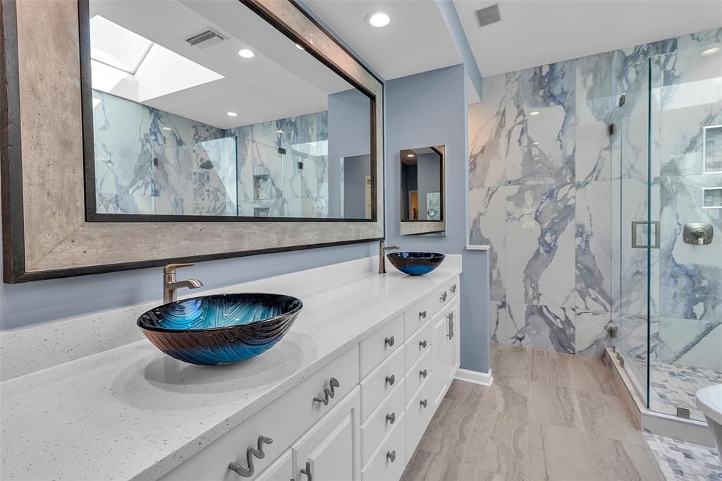 156 Bishopscourt Road Osprey, FL 34229 - Photo 44 of 84 a bathroom with a sink a toilet and shower