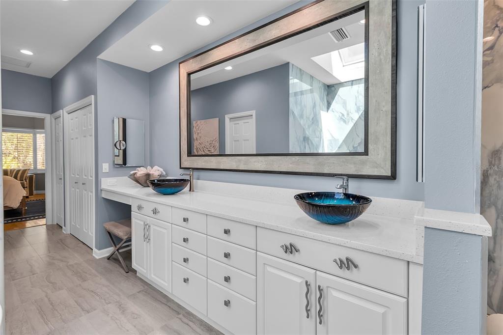 156 Bishopscourt Road Osprey, FL 34229 - Photo 46 of 84 a bathroom with a sink and a mirror