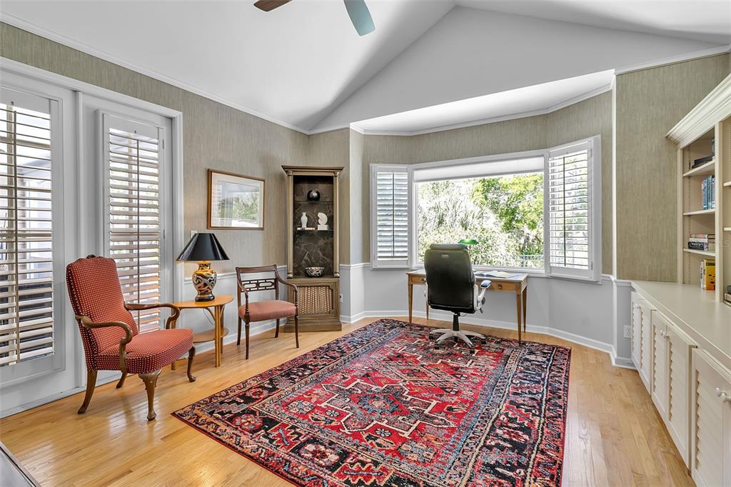 156 Bishopscourt Road Osprey, FL 34229 - Photo 48 of 84 a living room with furniture and a rug