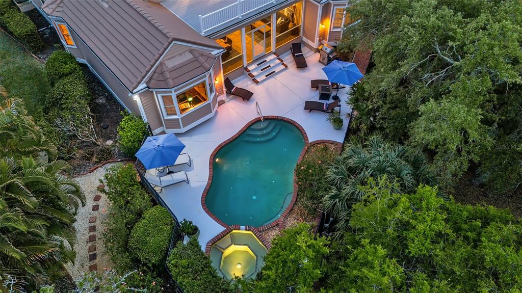 156 Bishopscourt Road Osprey, FL 34229 - Photo 5 of 84 an aerial view of a house with a swimming pool and garden