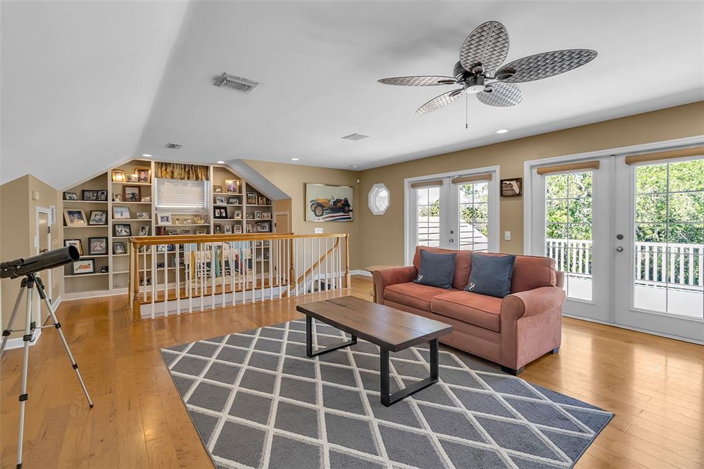 156 Bishopscourt Road Osprey, FL 34229 - Photo 59 of 84 a living room with furniture and a floor to ceiling window