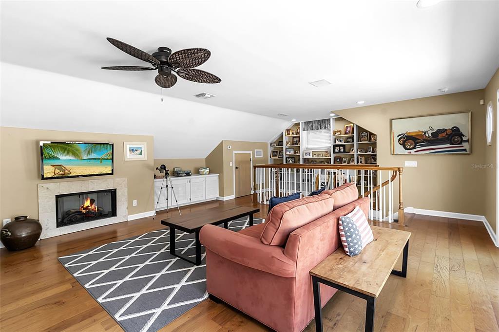 156 Bishopscourt Road Osprey, FL 34229 - Photo 60 of 84 a living room with furniture and a fireplace