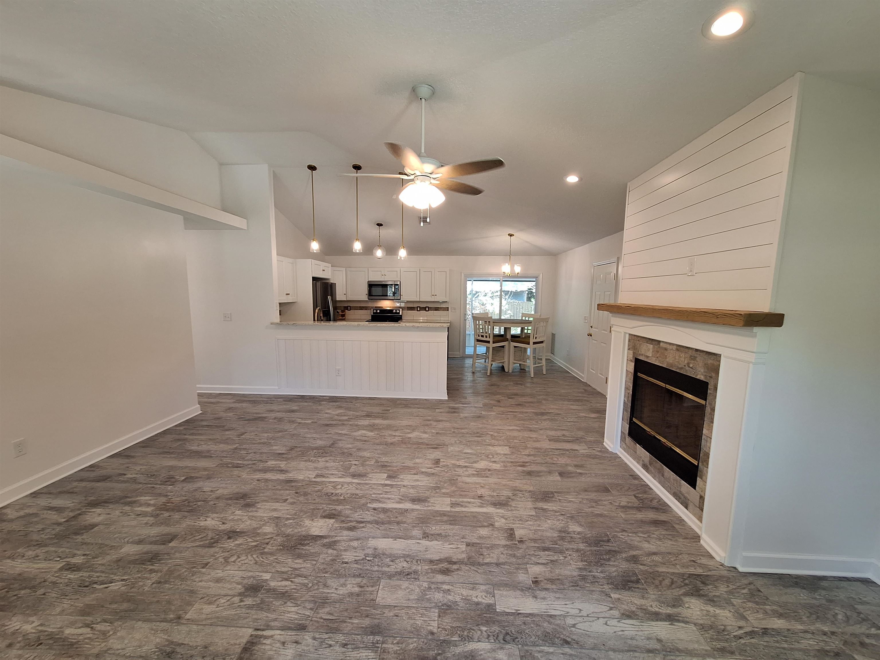 129 15th Street St. Augustine, FL 32080 - Photo 11 of 61 a view of a kitchen with a sink and a fireplace