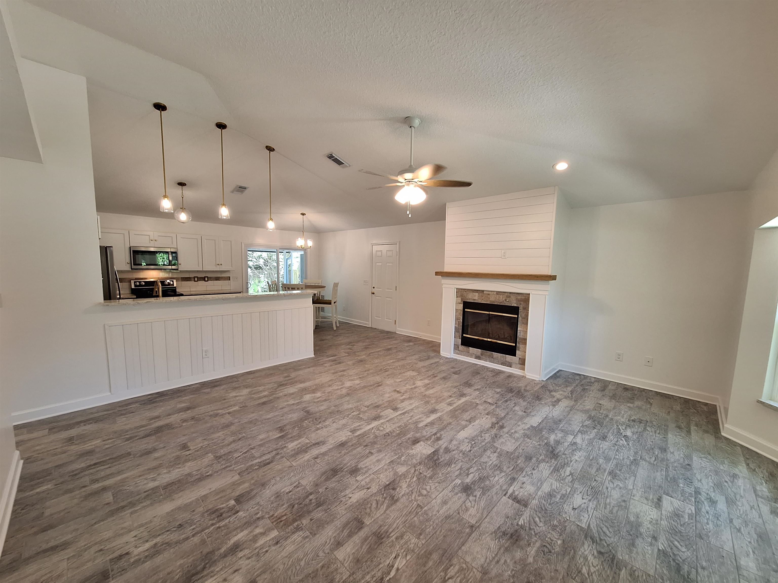 129 15th Street St. Augustine, FL 32080 - Photo 19 of 61 a view of a kitchen with a sink and a stove top oven