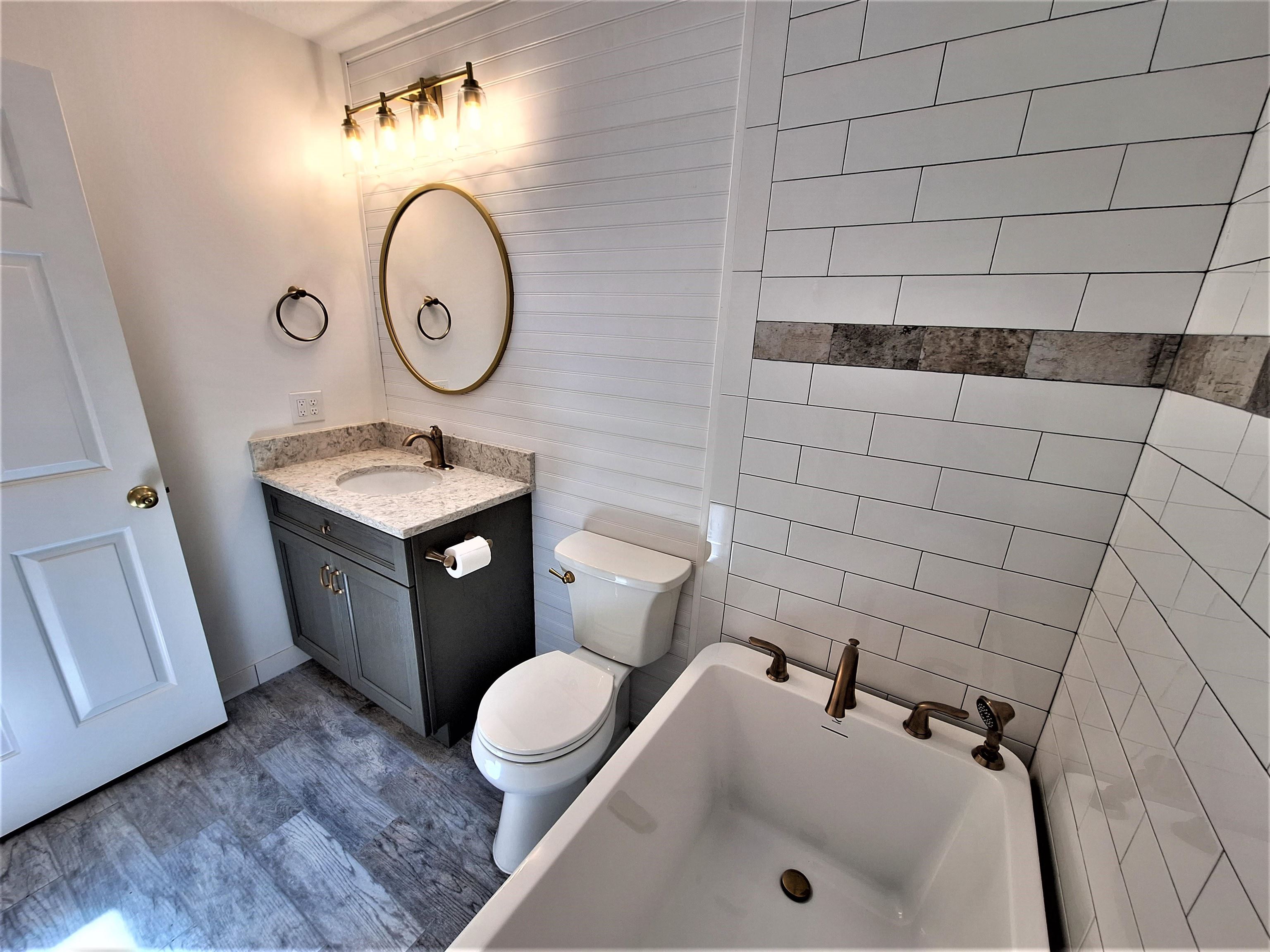 129 15th Street St. Augustine, FL 32080 - Photo 36 of 61 a bathroom with a sink and a mirror