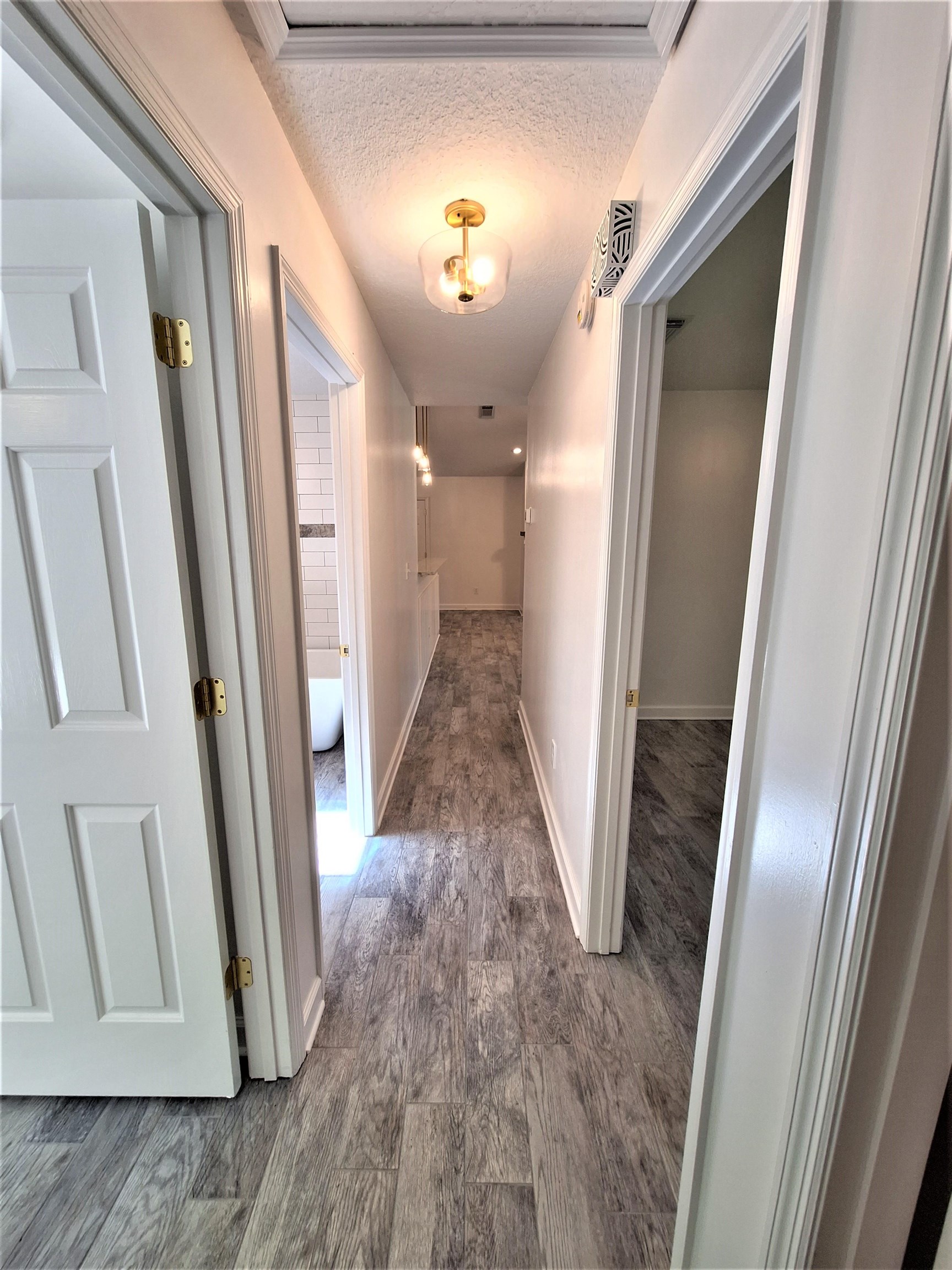 129 15th Street St. Augustine, FL 32080 - Photo 37 of 61 a view of a hallway with wooden floor
