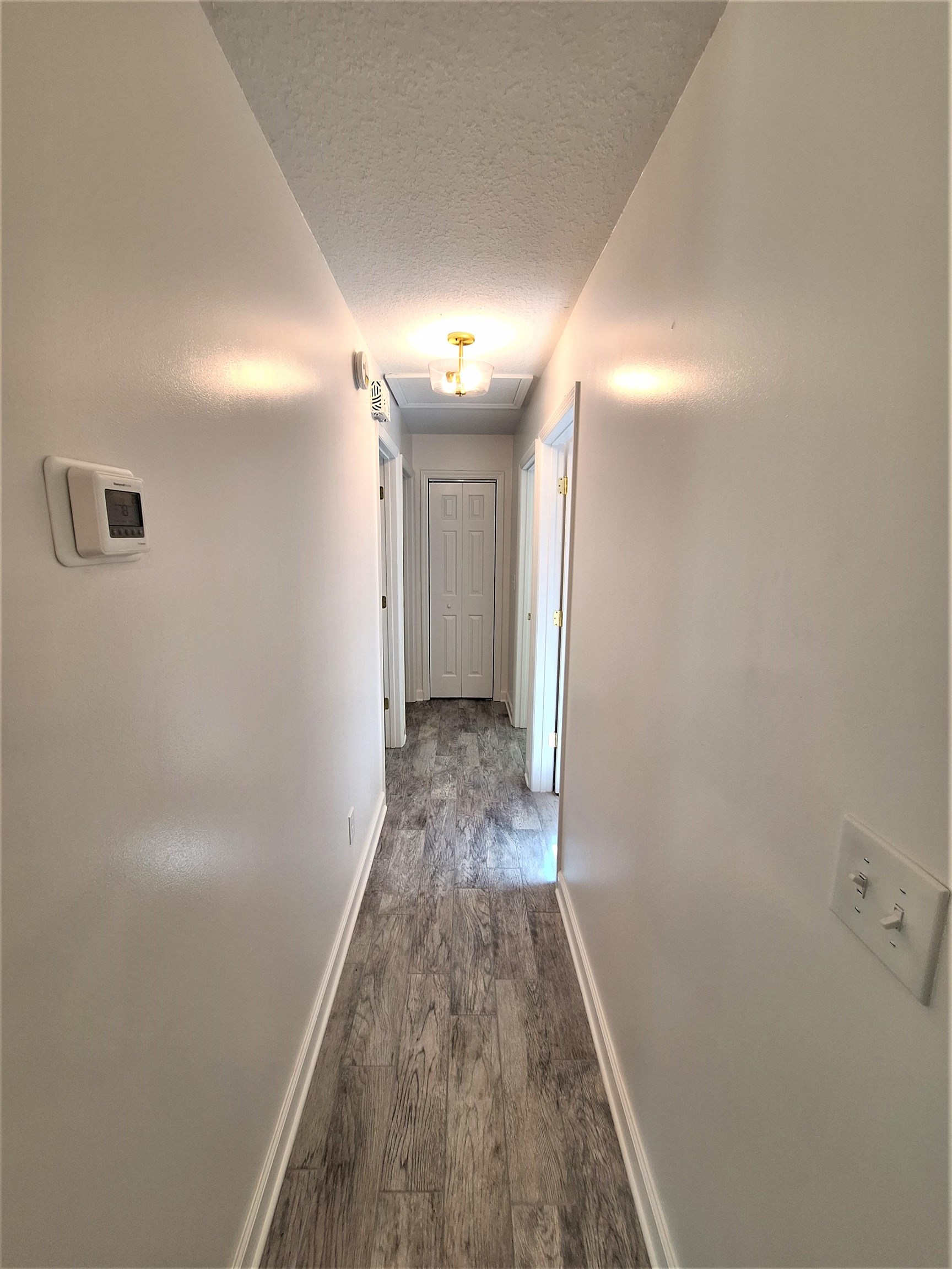 129 15th Street St. Augustine, FL 32080 - Photo 38 of 61 a view of a hallway with wooden floor