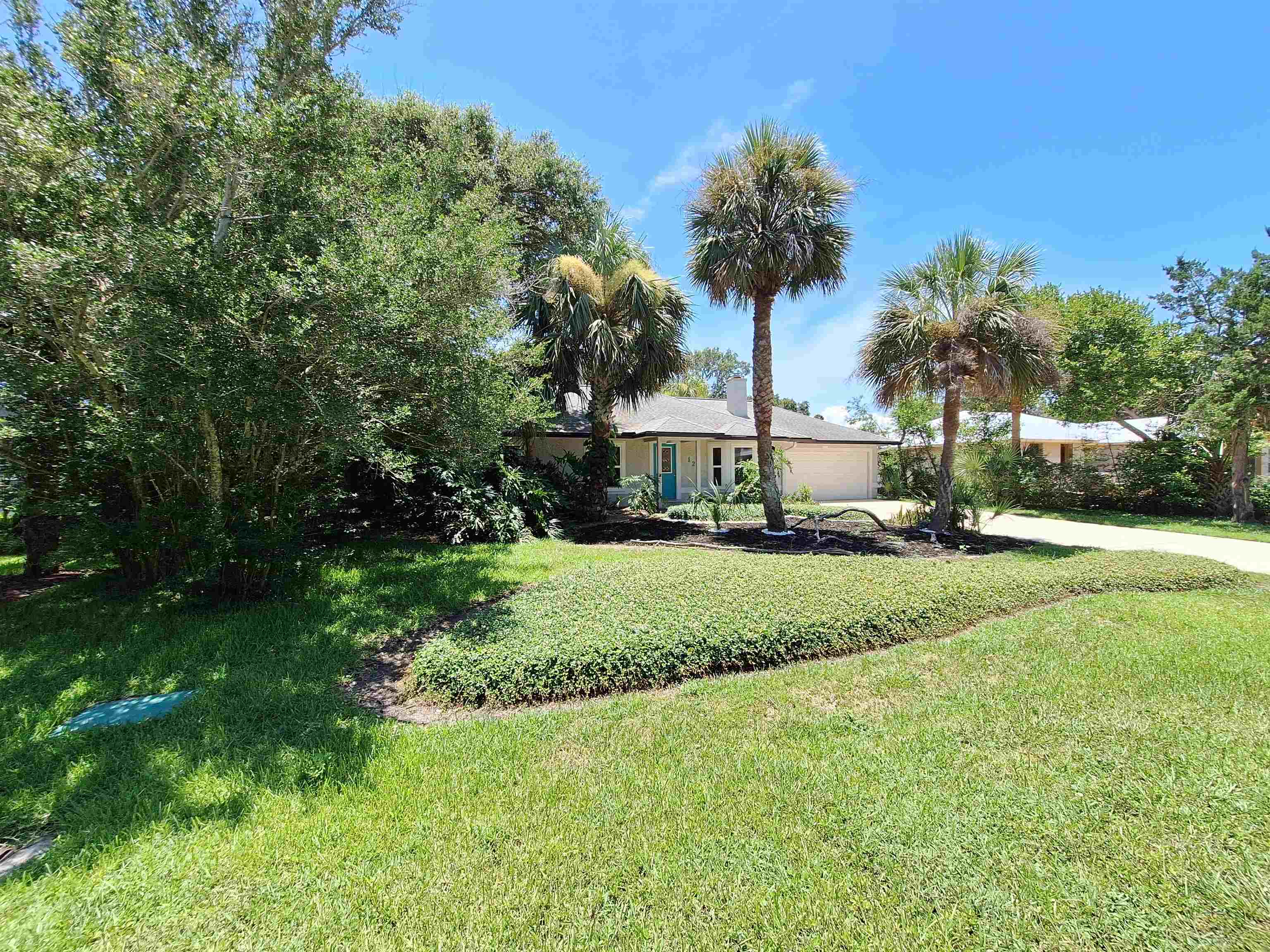129 15th Street St. Augustine, FL 32080 - Photo 56 of 61 a view of a house with a yard and tree s