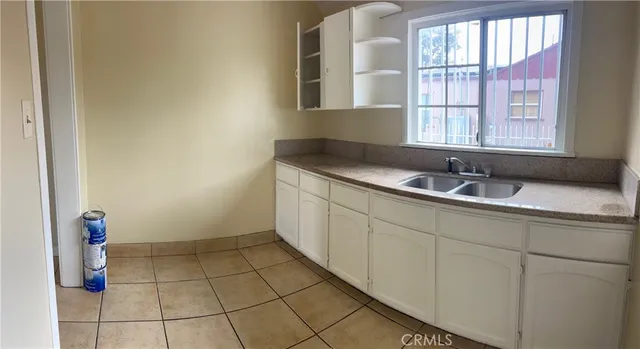 a bathroom with a sink and a window
