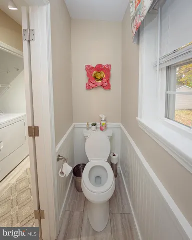 a bathroom with a toilet and a sink