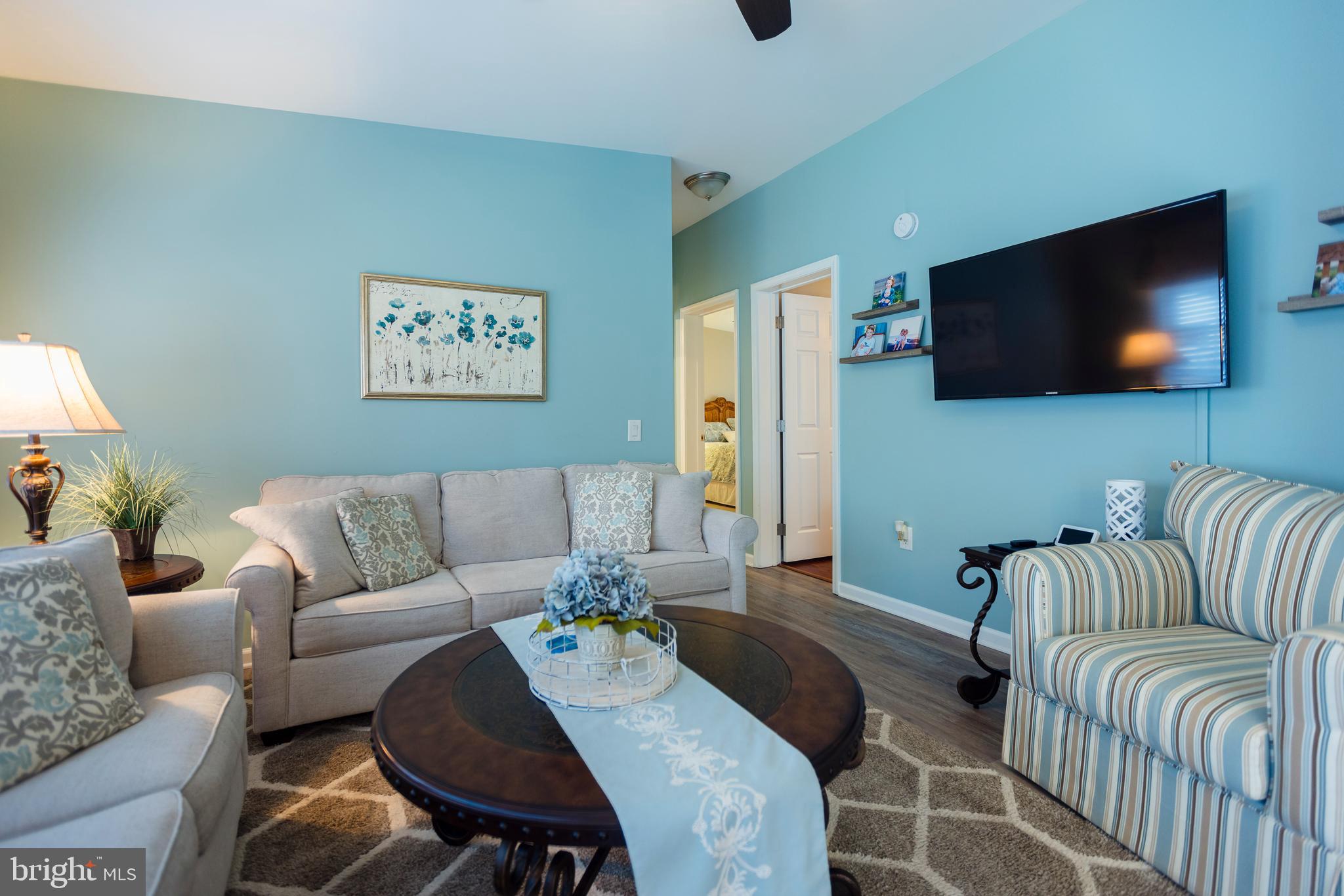 16 Cranberry Drive Cream Ridge, NJ 08514 - Photo 2 of 22 a living room with furniture and a flat screen tv