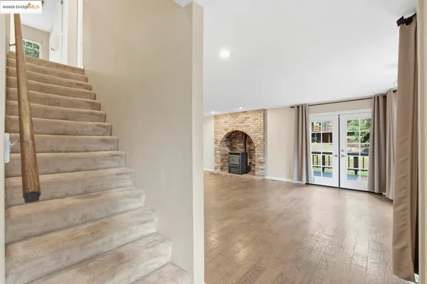 a view of an empty room with a kitchen stove back oven