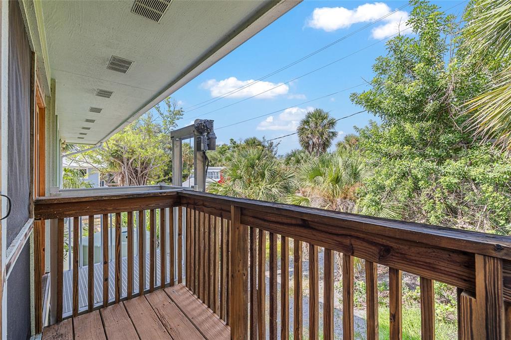 8178 Little Gasparilla Placida, FL 33946 - Photo 15 of 57 a view of a balcony with wooden floor