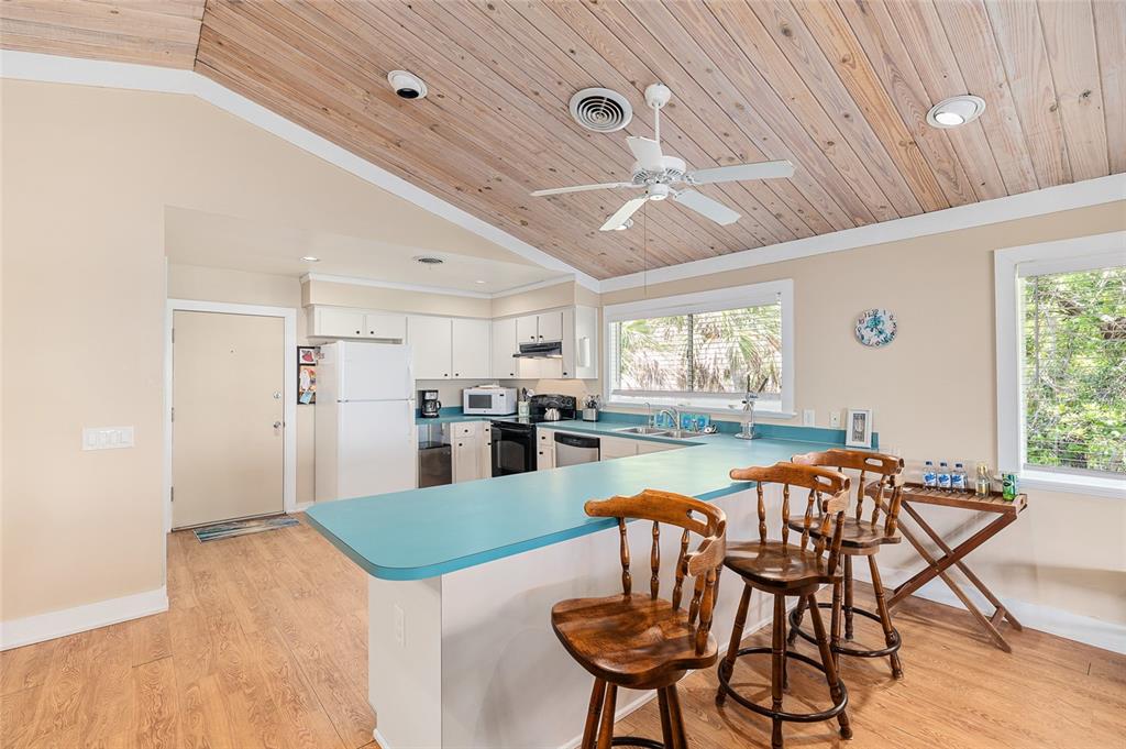 8178 Little Gasparilla Placida, FL 33946 - Photo 16 of 57 a view of a dining room with furniture and wooden floor