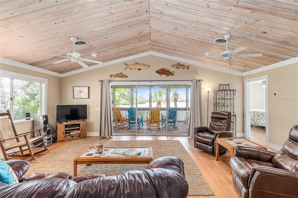 8178 Little Gasparilla Placida, FL 33946 - Photo 19 of 57 a living room with furniture and a flat screen tv