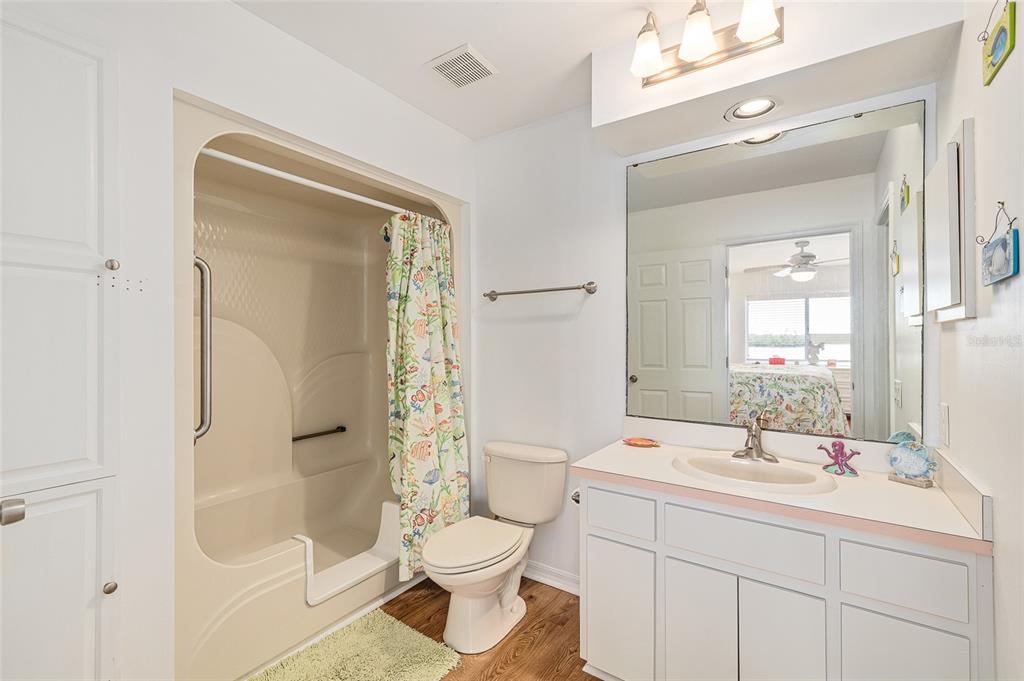 8178 Little Gasparilla Placida, FL 33946 - Photo 28 of 57 a bathroom with a sink a toilet and shower