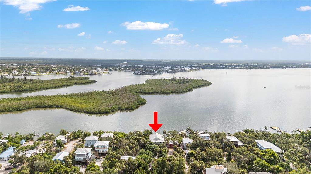 8178 Little Gasparilla Placida, FL 33946 - Photo 51 of 57 a view of a lake from a yard