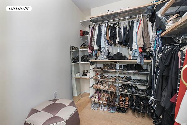 200 East 69th Street, Unit 4R Manhattan, NY 11360 - Photo 4 of 5 a view of walk in closet with clothes and shoes
