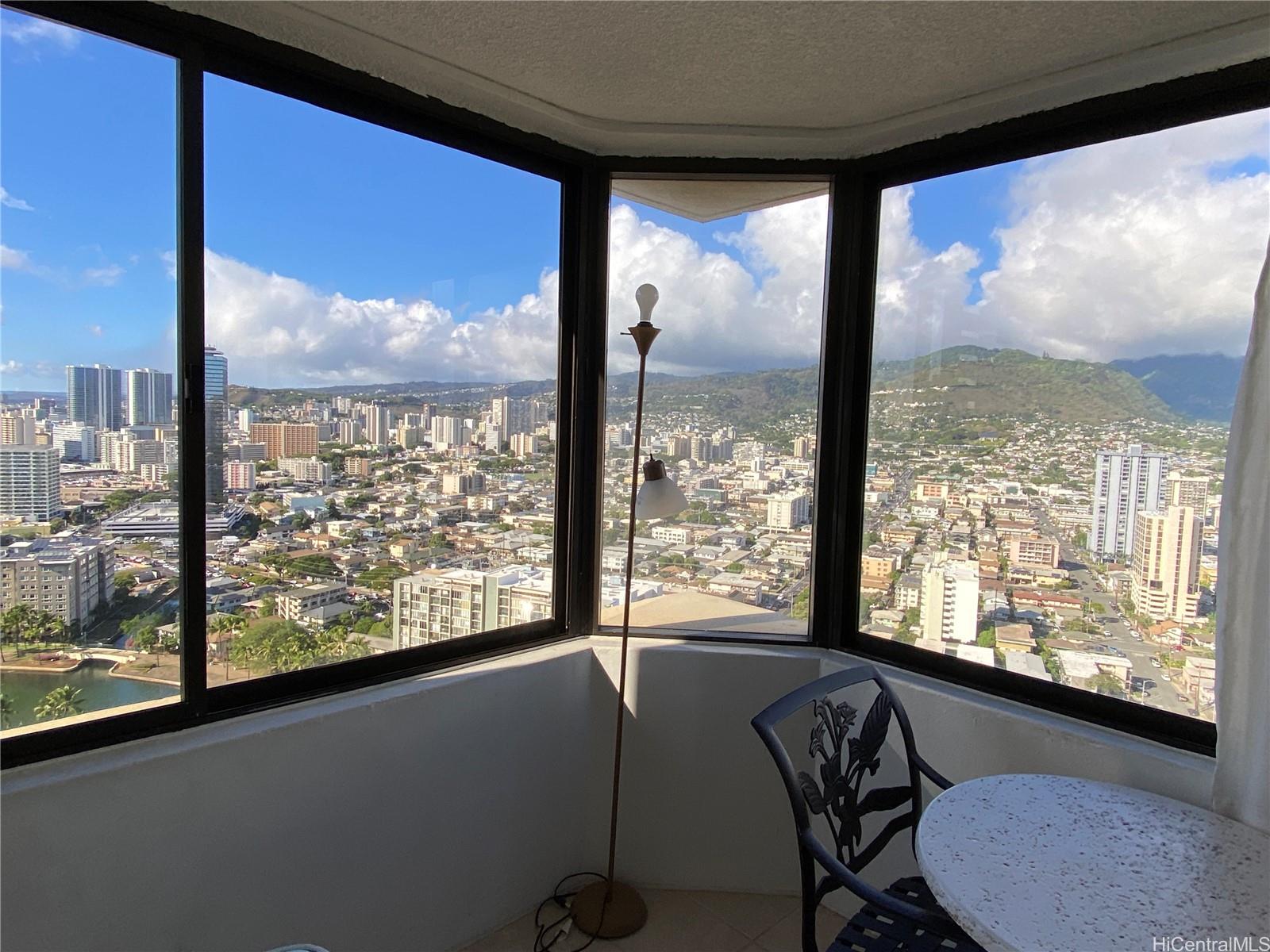 444 Niu Street, Unit 3407A Honolulu, HI 96815 - Photo 4 of 13 a view of a room with workspace and windows